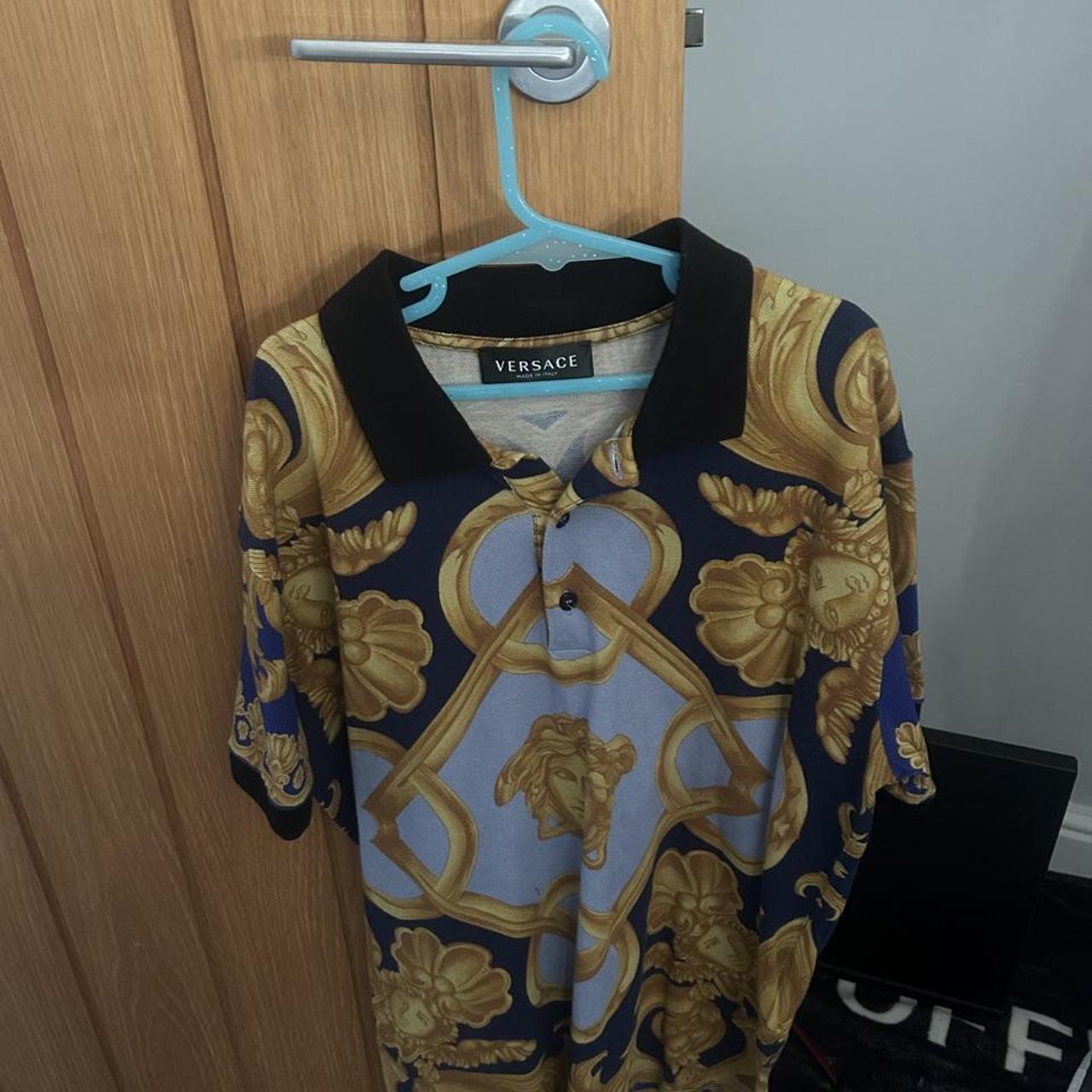 Versace polo shirt with gold and blue baroque-style...